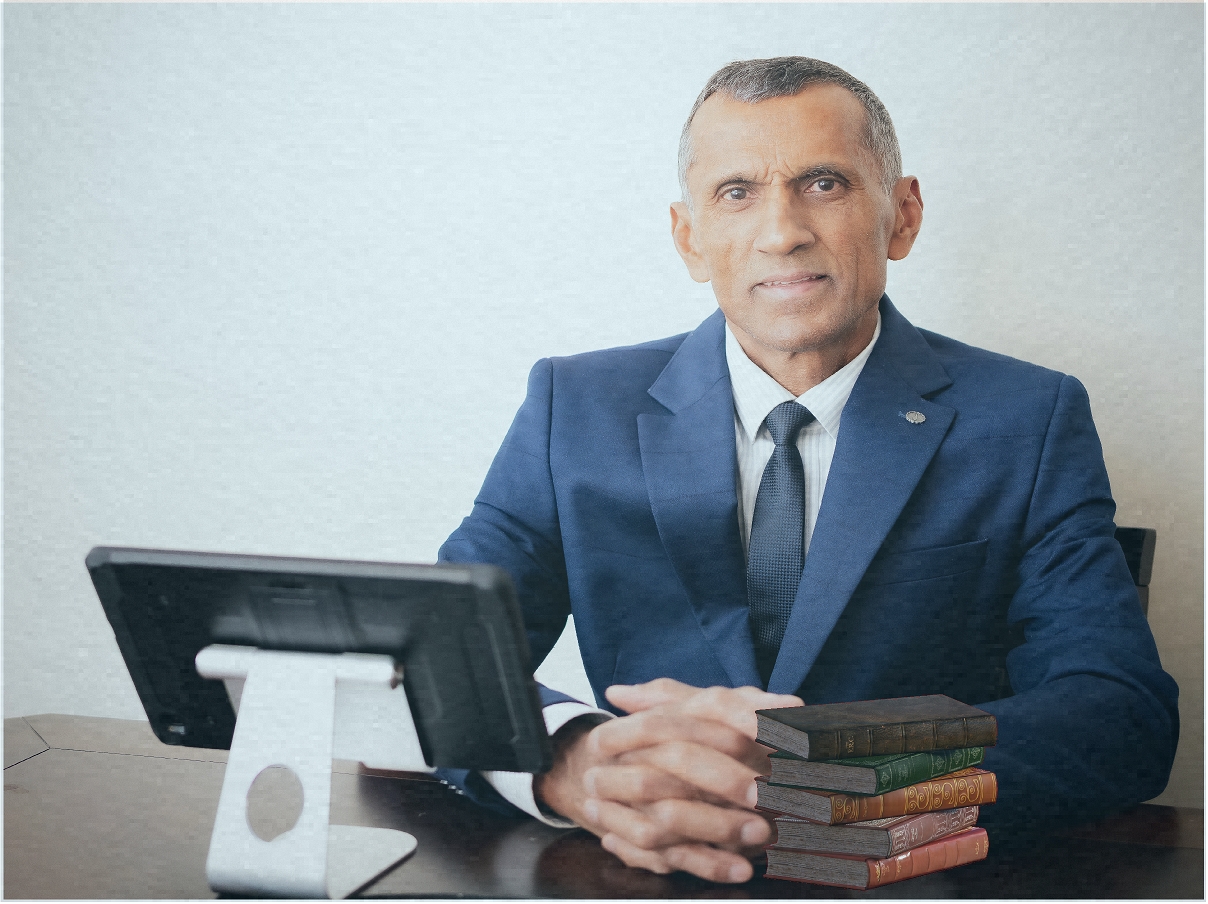 carl at desk with books